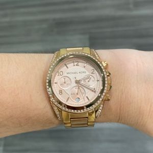 Rose gold tone Michael Kors watch.